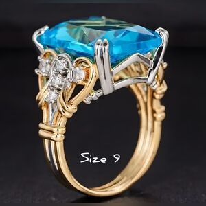 Bermuda Blue synthetic Topaz statement ring, Szs. 9& 9.5. gold plated, two tone